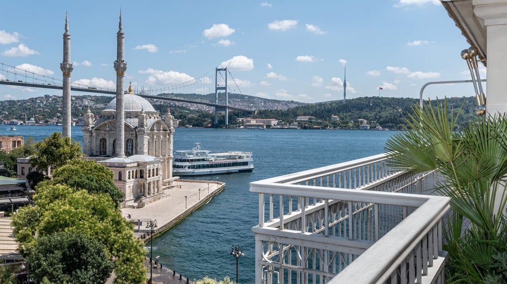 Luxurious penthouse suite overlooking Bosphorus, featuring modern design, floor-to-ceiling windows, sleek furnishings, and panoramic Istanbul skyline view