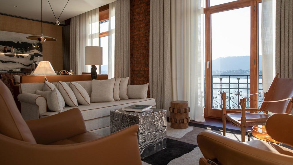 Luxury hotel exterior at lakeside with elegant Swiss architecture, featuring pristine white façade and panoramic views of Zurich's scenic waterfront landscape