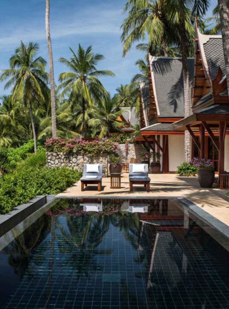 Elegant ocean-view pavilion with infinity pool, teak sun deck and traditional Thai architecture overlooking Andaman Sea sunset