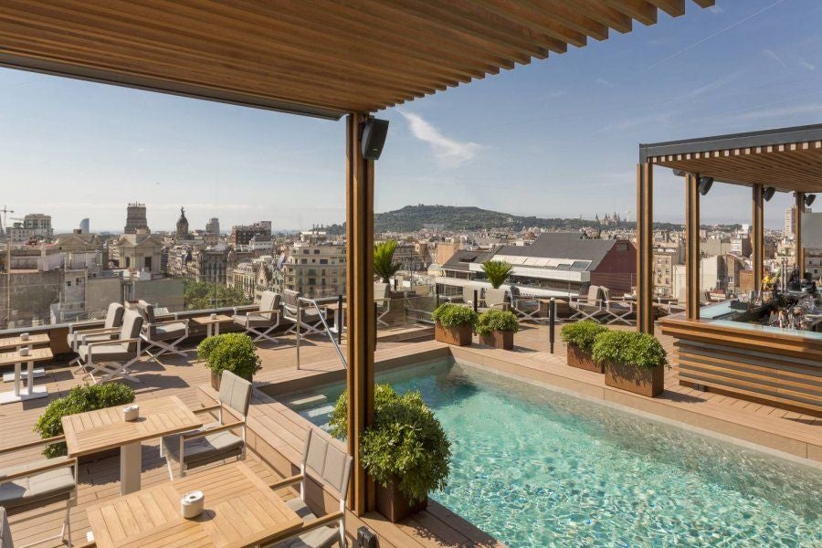 Elegant five-star Majestic Hotel & Spa facade in Barcelona featuring ornate neoclassical architecture with wrought-iron balconies