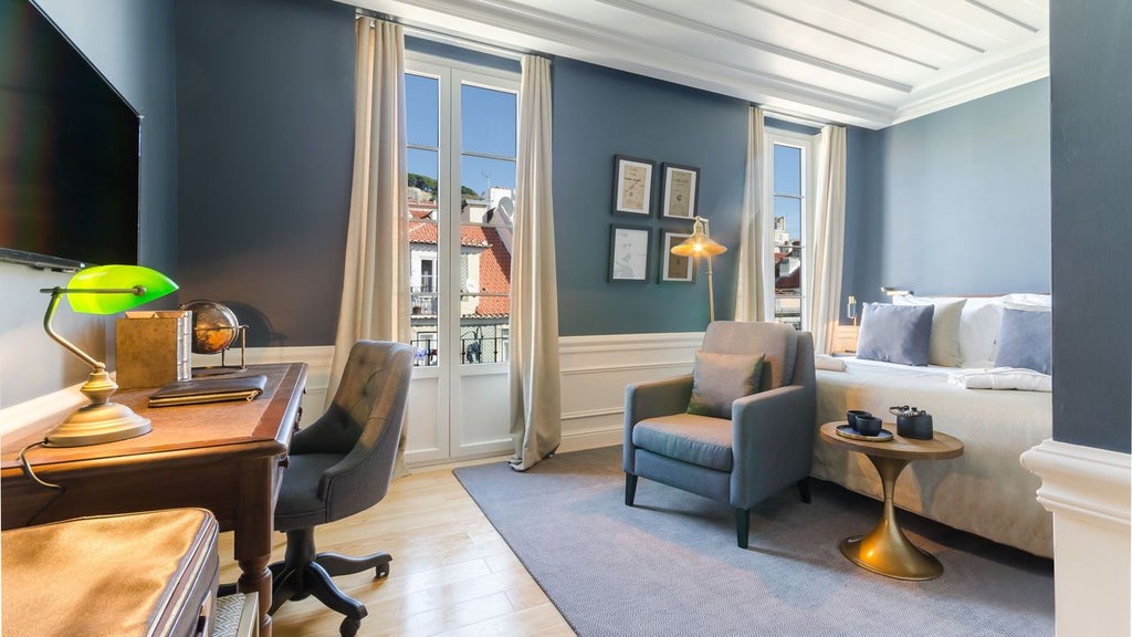 Elegant boutique hotel facade in Porto's historic downtown, featuring traditional Portuguese architecture with wrought-iron balconies and warm stone exterior