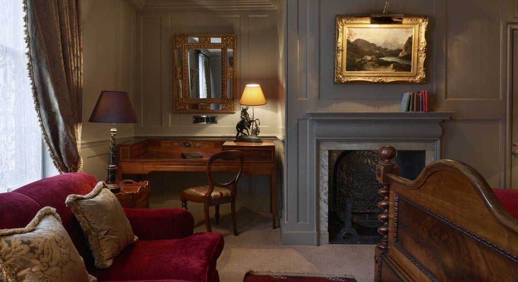 Elegant Georgian townhouse hotel with antique furnishings, rich wooden interiors, and plush four-poster bed in historic London setting