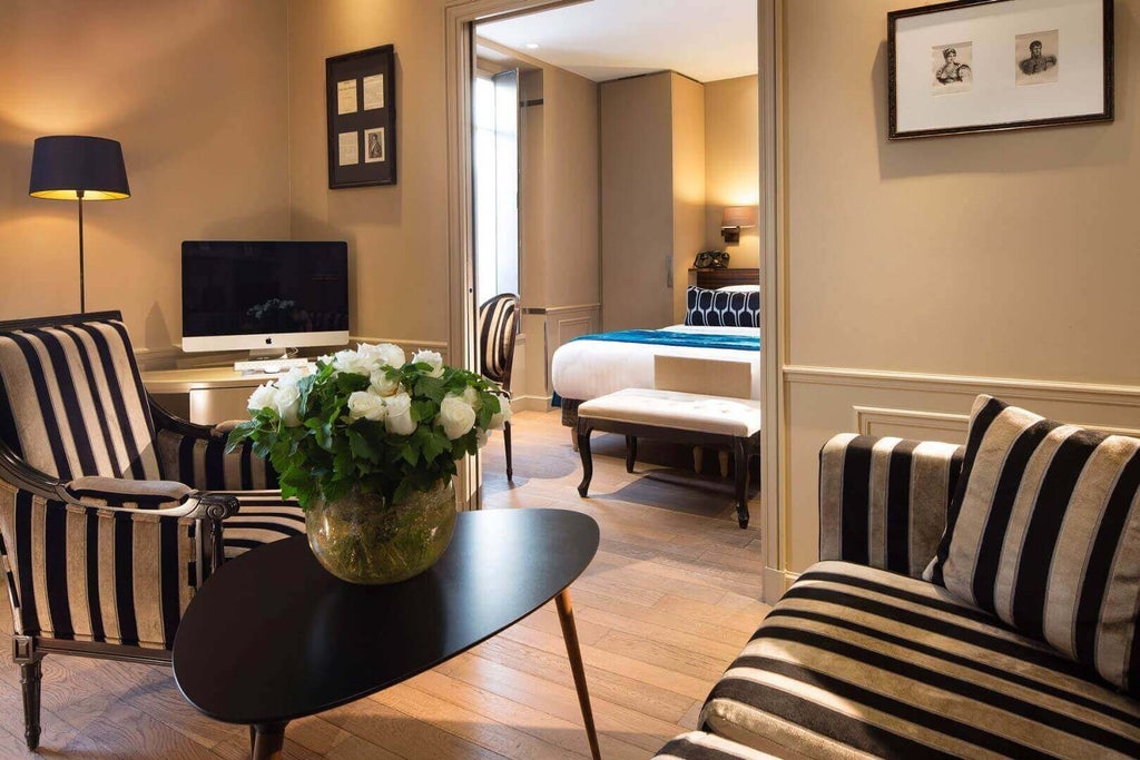 Elegant French garden duplex suite with plush furnishings, soft neutral tones, and natural light streaming through large windows at boutique Hotel & Spa La Belle Juliette