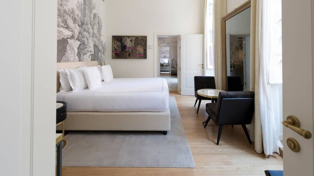 Elegant grand suite with plush king bed, marble bathroom, designer furniture, and panoramic city view in luxurious boutique hotel in historic Rome center