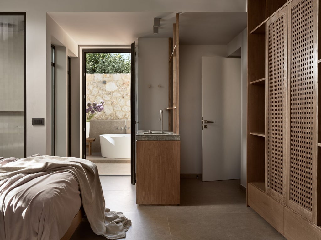 Luxurious whitewashed Greek villa bedroom with elegant four-poster bed, panoramic sea view, and minimalist Cycladic design elements in soft, neutral tones.